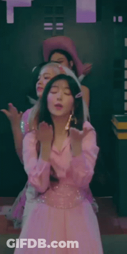 Woman In Pink Dress Standing With Others GIF