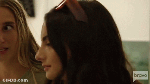 Woman In Pink Dress With Flower At Bravo House GIF