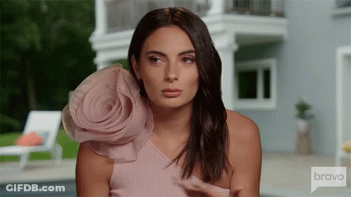 Woman In Pink Dress With Flower At House On Bravo GIF