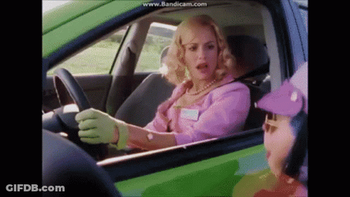Woman In Pink Driving Green Car Talks To Purple Hat Man GIF