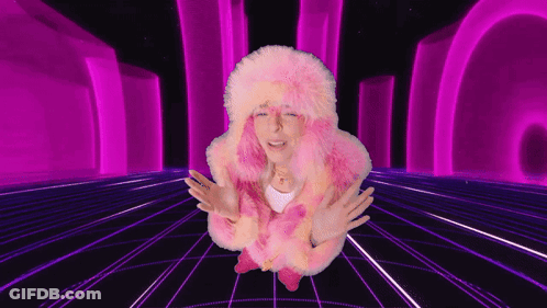 Woman In Pink Fur Coat Standing In Purple Tunnel GIF