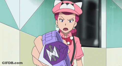 Woman In Pink Hat Holding Purple Cube GIF