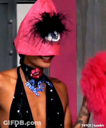 Woman In Pink Hat With Feathers GIF