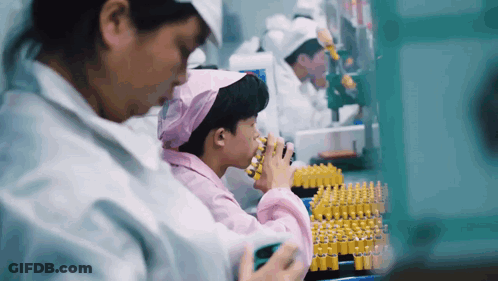 Woman In Pink Head Scarf Working In Lab GIF