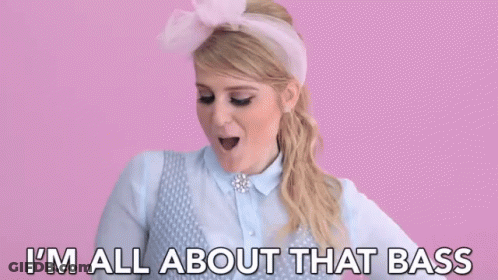 Woman In Pink Headband Saying I'm All About That Bass GIF