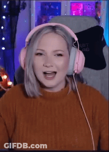 Woman In Pink Headphones Laughing GIF