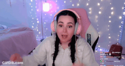 Woman In Pink Headphones Sitting In Pink Chair With Merc GIF