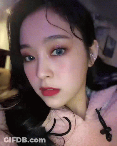 Woman In Pink Hoodie Close Up GIF