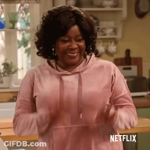 Woman In Pink Hoodie Standing In Kitchen Netflix GIF