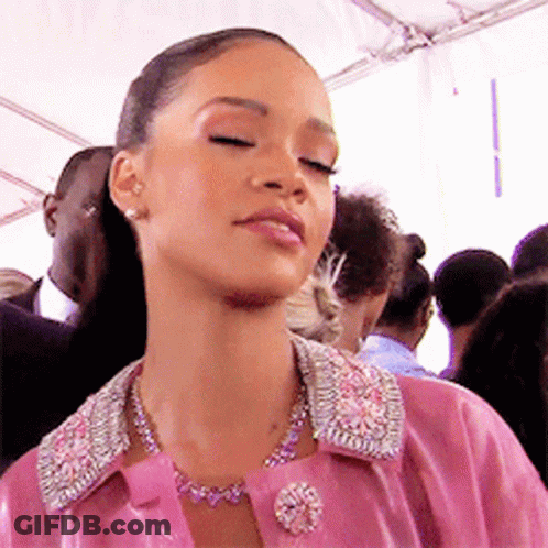 Woman In Pink Jacket And Necklace GIF