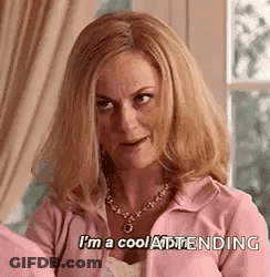 Woman In Pink Jacket And Necklace Says I'm A Cool Attendee GIF
