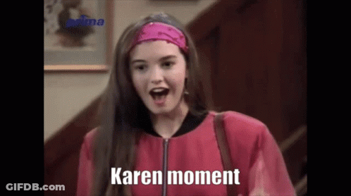 Woman In Pink Jacket, Headband Saying Karen Moment GIF