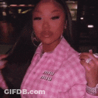 Woman In Pink Jacket Holding Pink Object GIF
