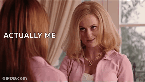 Woman In Pink Jacket Looking In Mirror Saying Actually Me GIF