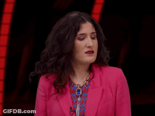 Woman In Pink Jacket Making Funny Face GIF