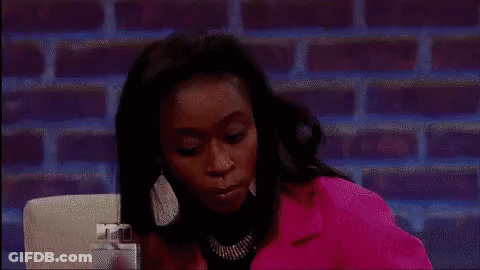 Woman In Pink Jacket Making Funny Face GIF