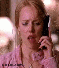 Woman In Pink Jacket On Cellphone GIF