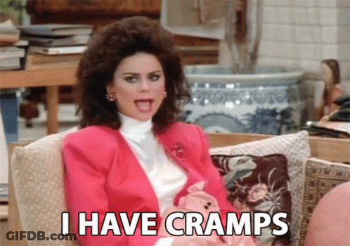 Woman In Pink Jacket Saying I Have Cramps GIF
