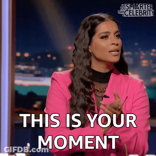 Woman In Pink Jacket Saying This Is Your Moment GIF