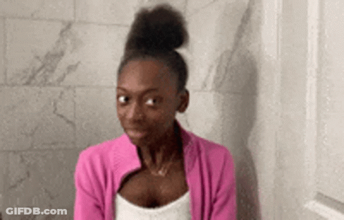 Woman In Pink Jacket Sitting On Toilet GIF