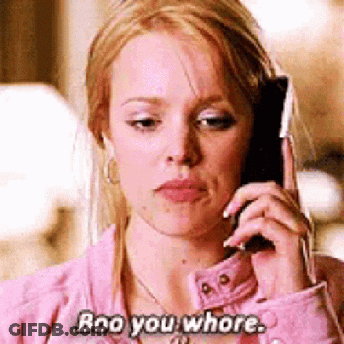 Woman In Pink Jacket Talking On Cell Phone Saying Boo You Whore GIF