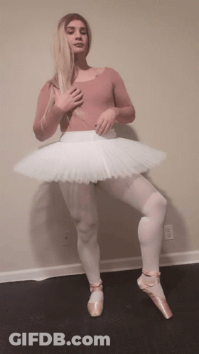 Woman In Pink Leotard And White Tutu Standing On One Leg GIF