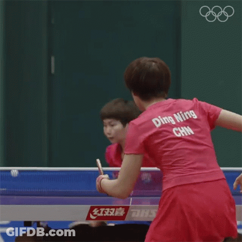Woman In Pink Ping Pong Shirt Playing Ping Pong GIF