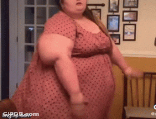 Woman In Pink Polka Dot Dress Dancing GIF