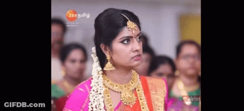 Woman In Pink Sari And Gold Jewelry Crowd GIF