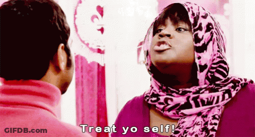 Woman In Pink Scarf Talking To Man In Pink Sweater GIF