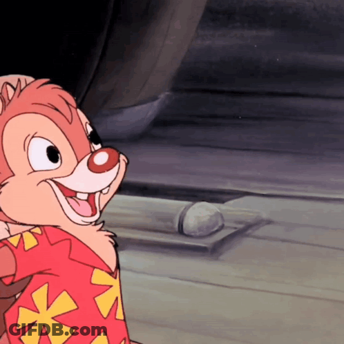 Woman In Pink Scrub Top Talking To Man In Mask GIF