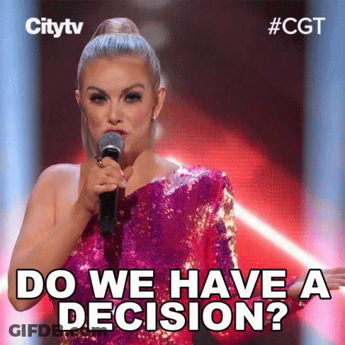 Woman In Pink Sequined Dress Holding Microphone Says Do We Have A Decision GIF