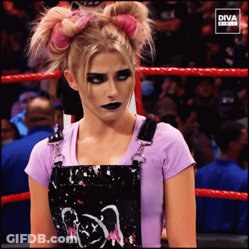 Woman In Pink Shirt And Black Skirt In Front Of Diva Digital Screen GIF