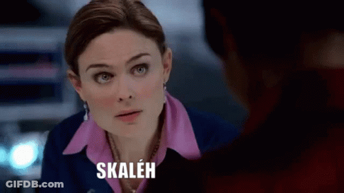 Woman In Pink Shirt And Blue Jacket Talking To Man Skalen GIF