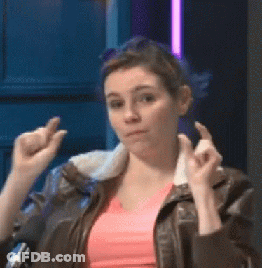 Woman In Pink Shirt And Brown Leather Jacket Making Funny Face GIF