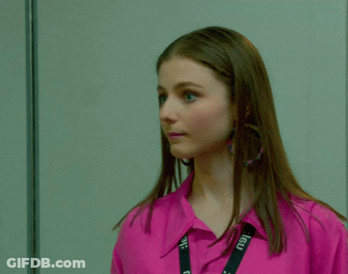 Woman In Pink Shirt And Earrings GIF