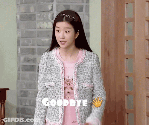 Woman In Pink Shirt And Grey Jacket Saying Goodbye GIF