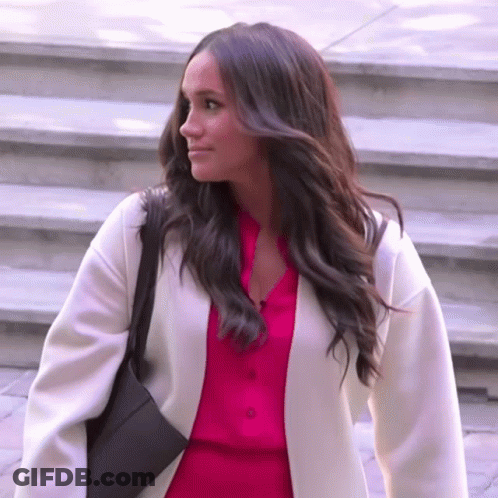 Woman In Pink Shirt And White Coat GIF