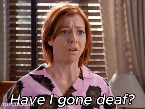 Woman In Pink Shirt Asking If She's Gone Deaf GIF