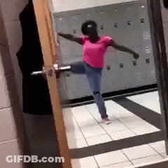 Woman In Pink Shirt Dancing In Locker Room GIF