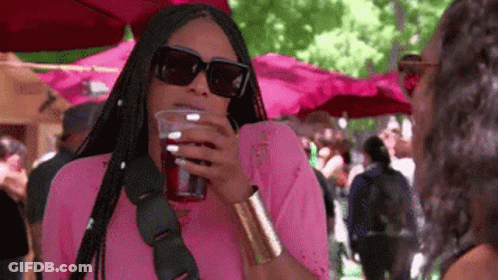 Woman In Pink Shirt Drinking GIF