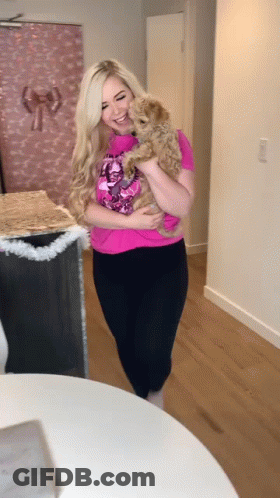 Woman In Pink Shirt Holding Dog GIF