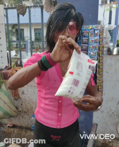 Woman In Pink Shirt Holding Vivavideo Bag GIF