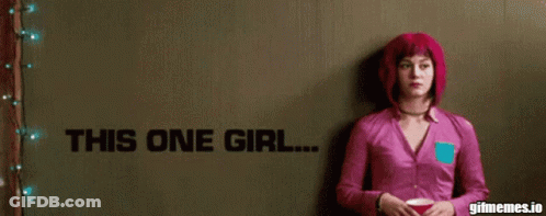 Woman In Pink Shirt In Front Of His One Girl Wall GIF