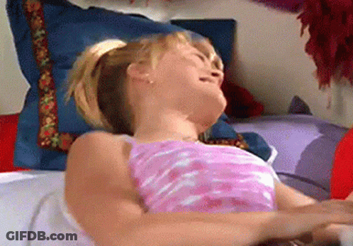 Woman In Pink Shirt Laying Head Down GIF