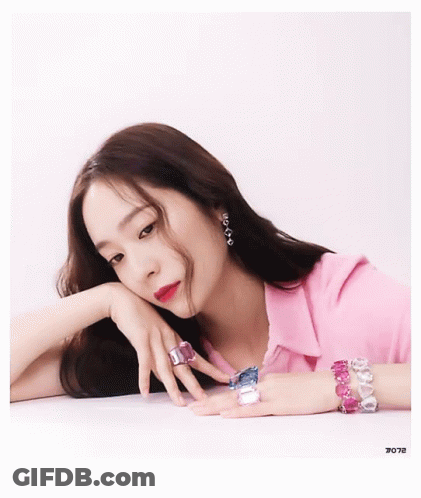 Woman In Pink Shirt Laying On Table GIF