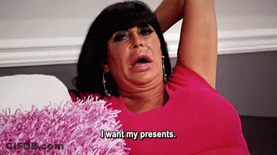 Woman In Pink Shirt Making Funny Face On Couch GIF