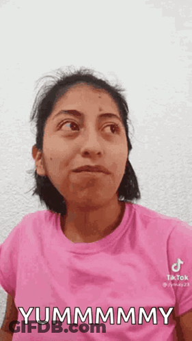 Woman In Pink Shirt Making Funny Face GIF