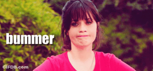Woman In Pink Shirt Making Funny Face Saying Bummer GIF
