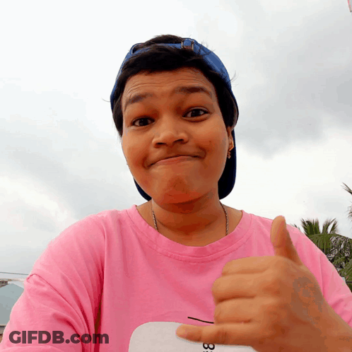 Woman In Pink Shirt Number 33 Giving Thumbs Up GIF